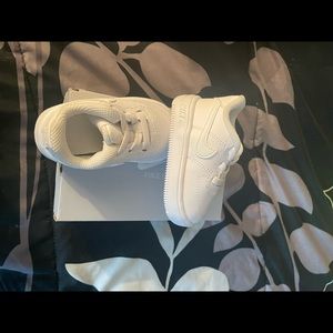 Brand new White Air Force ones never worn. Size 3C